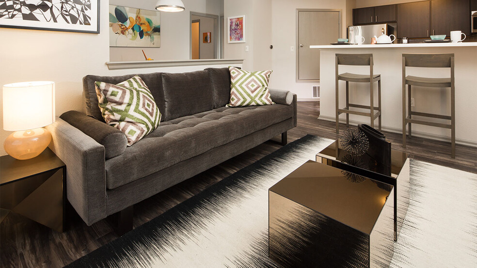 Apartment Living Room with wood floors. - Griffis Lafayette Station