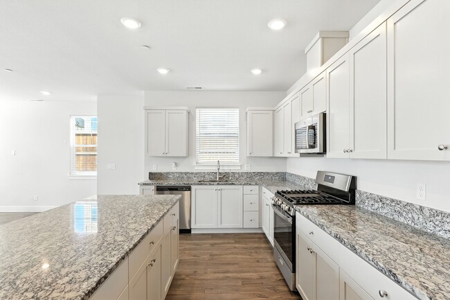 Building Photo - Spacious 5-Bedroom Home with Modern Upgrad...
