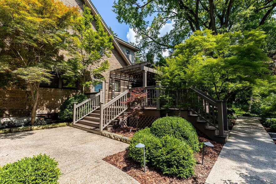 Stairway to garage and spacious parking area - 4061 Beechwood Ave