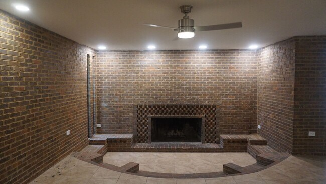 Building Photo - Four Bed - Three Bath - Large Storage Area...