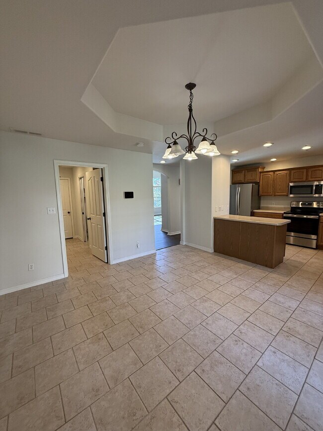 Building Photo - Spacious 3 BR with a fenced in backyard