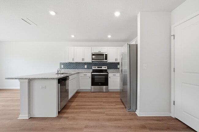 Building Photo - New community! Three bedrooms, two bathrooms and ready for you to move into!