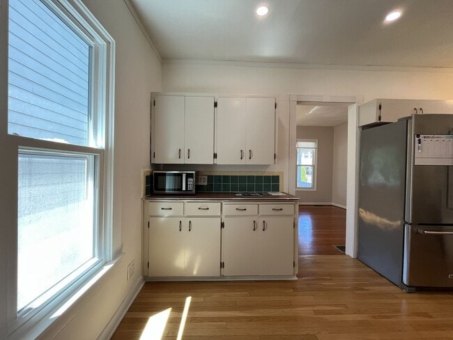 Building Photo - Charming Cottage with Hardwood Flooring, Modern Kitchen & Beautiful Outdoor Living Areas