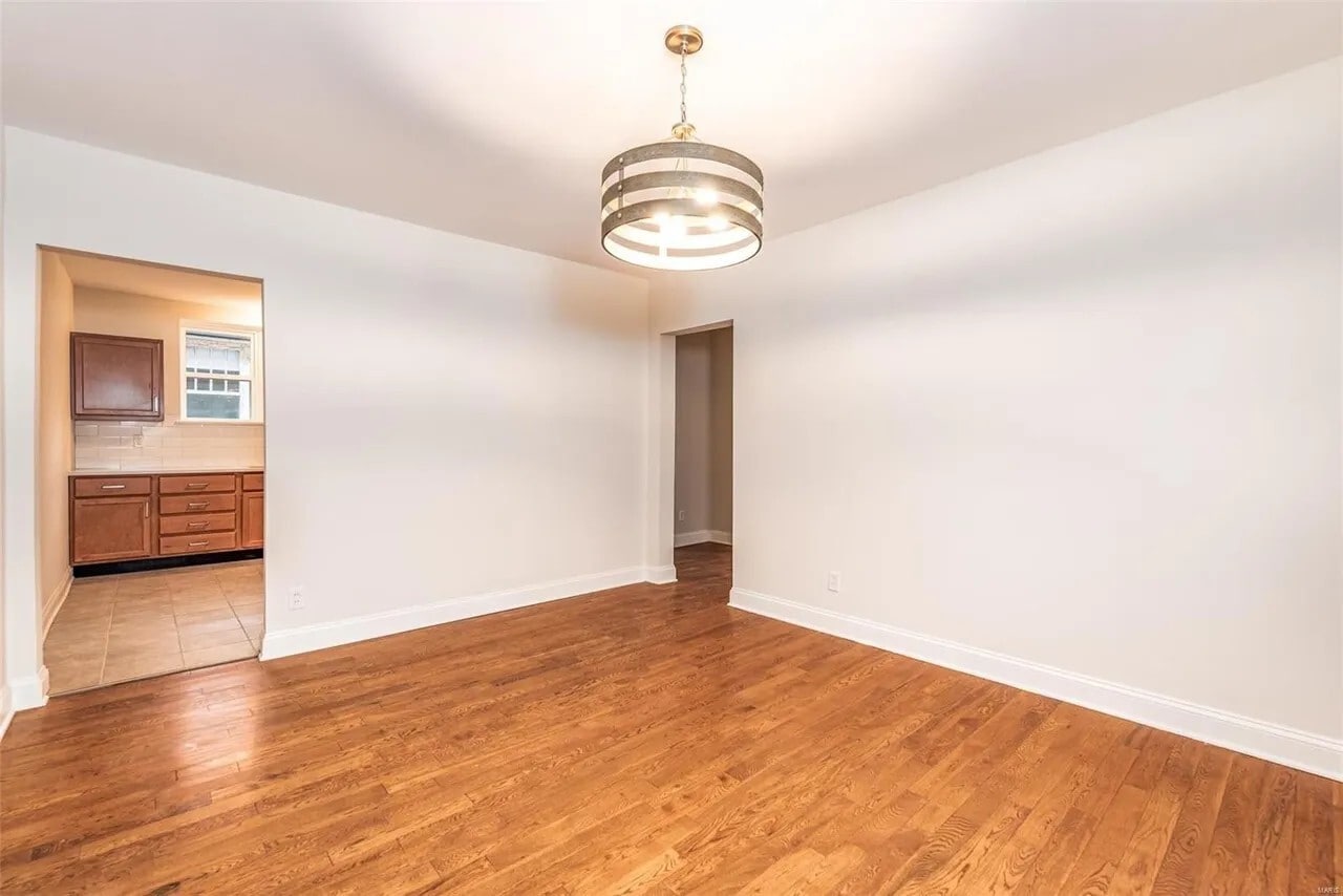 living room, kitchen and hall entryways - 7136 Amherst Ave