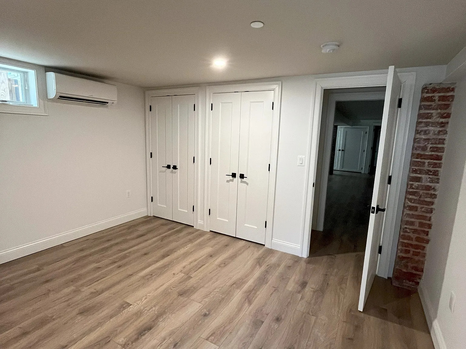 Bedroom (flex room) adjacent to the rear entry and private outdoor areaway. - 1755 Lamont St NW