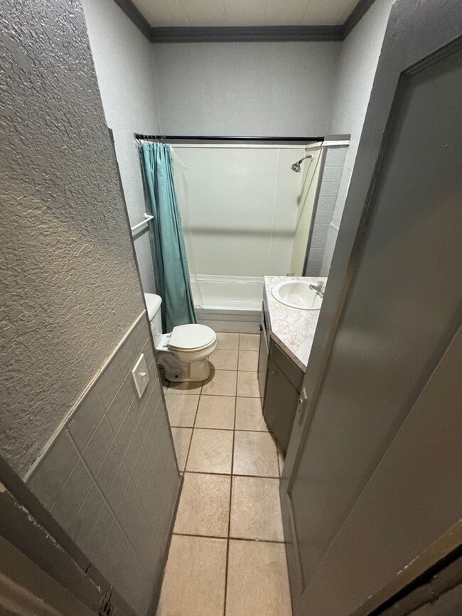 Building Photo - Three bedroom two bath home with central heat and air, large fenced backyard, and carport!