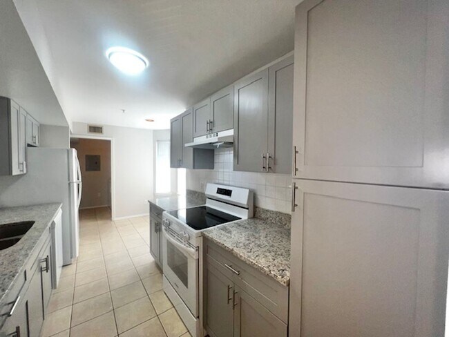 Building Photo - NEW-Remodeled bathroom & kitchen! NEW VINYL PLANK flooring & fresh paint! 2 bedroom 1 bath condo ...