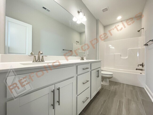 Building Photo - Amazing 4 Bedroom, 2.5 Bathroom Home with 1st Floor Primary Bedroom Suite, High Speed Internet, a...