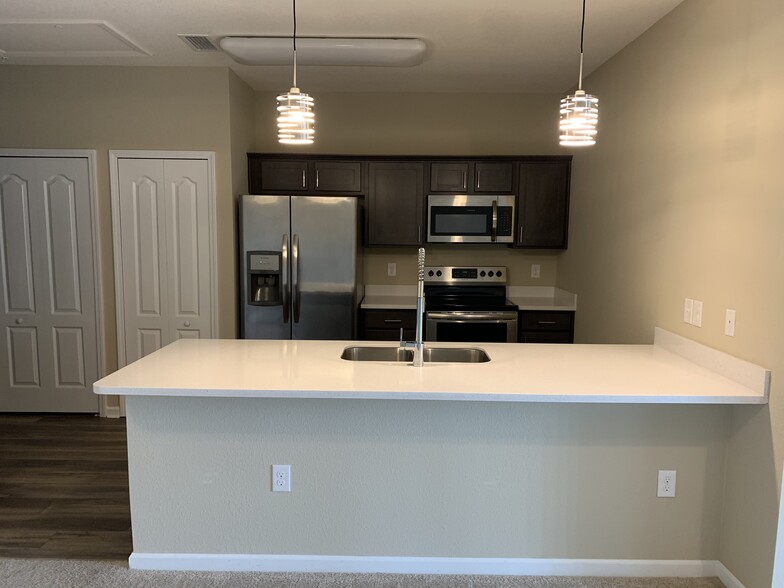 Kitchen, solid surface counter/ breakfast bar - 4966 Key Lime Dr