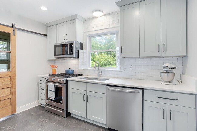 Building Photo - Class Brick Cottage with Modern Comforts in Historic Overbrook