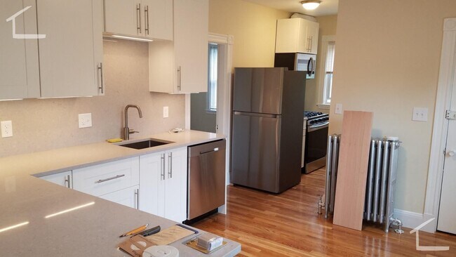 Building Photo - Large, newly renovated 3 bed near the Green Line and Commuter Rail!