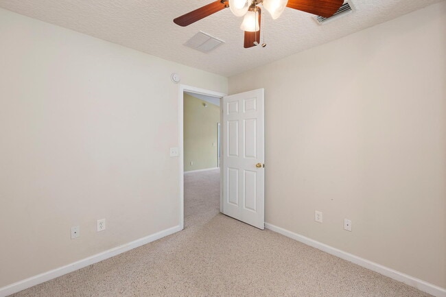 Building Photo - Beautifully Updated & Spacious 3BR/2BA Condo in a Secure Gated Community — Includes Cable, Intern...
