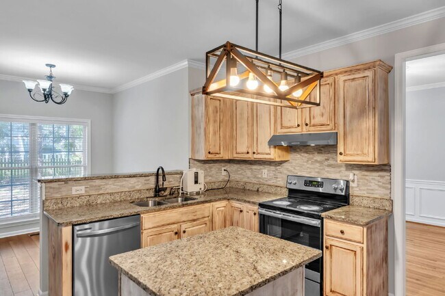 Building Photo - Beautifully Appointed 4BR Home Featuring a Screened Porch, Spacious Living Areas & Community Pool...