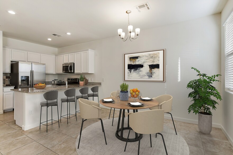 Dining area and kitchen with room for bar top seating - Casa Sole Vita Townhomes