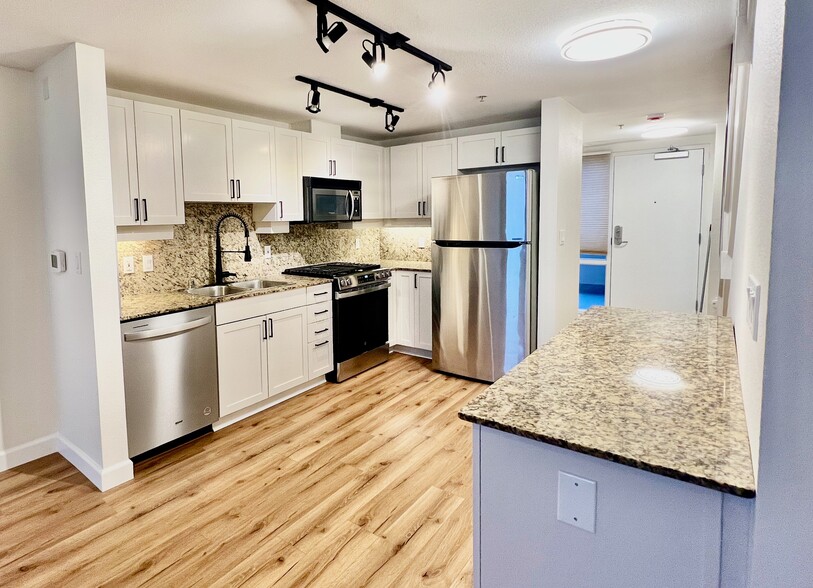 After renovation, modern sleek kitchen with brand new oven. - 1240 India St