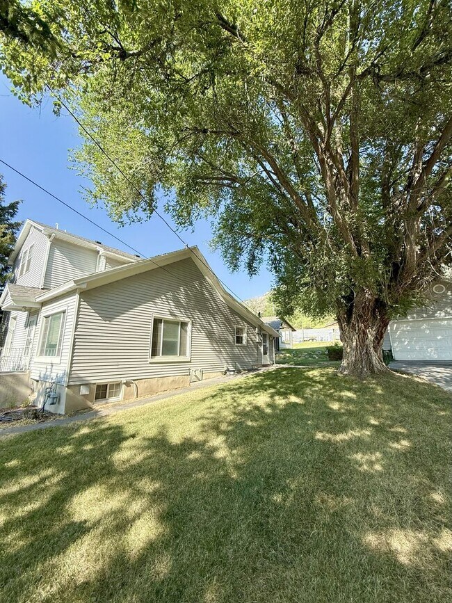 Building Photo - Timeless Charm, Modern Living — 4-Bed Gem ...
