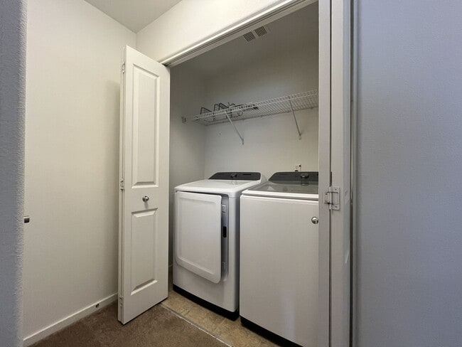 Building Photo - Beautiful 2 Bedroom Townhome with Walk-In Closets Private Deck & Attached Garage