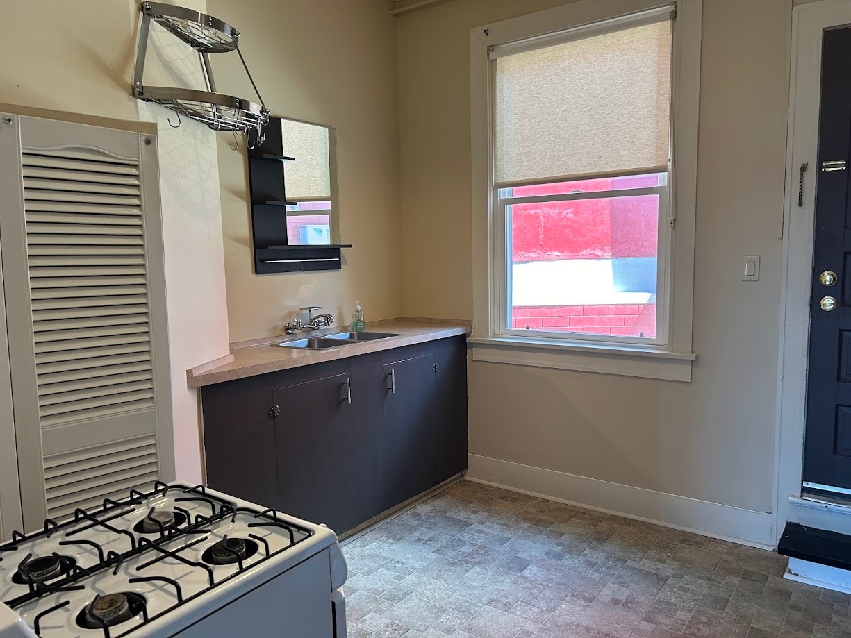Kitchen window lets in lots of natural light; enough room for a small table/chair - 4537 SE 65th Ave