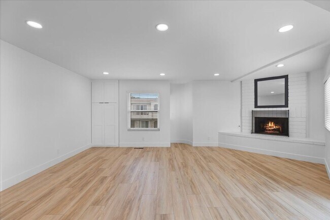 Building Photo - COMPLETELY REMODELED, BRIGHT & AIRY, TRI-LEVEL HOME W/ TOP-FLOOR GREAT ROOM LIVING SPACE, 2-CAR G...