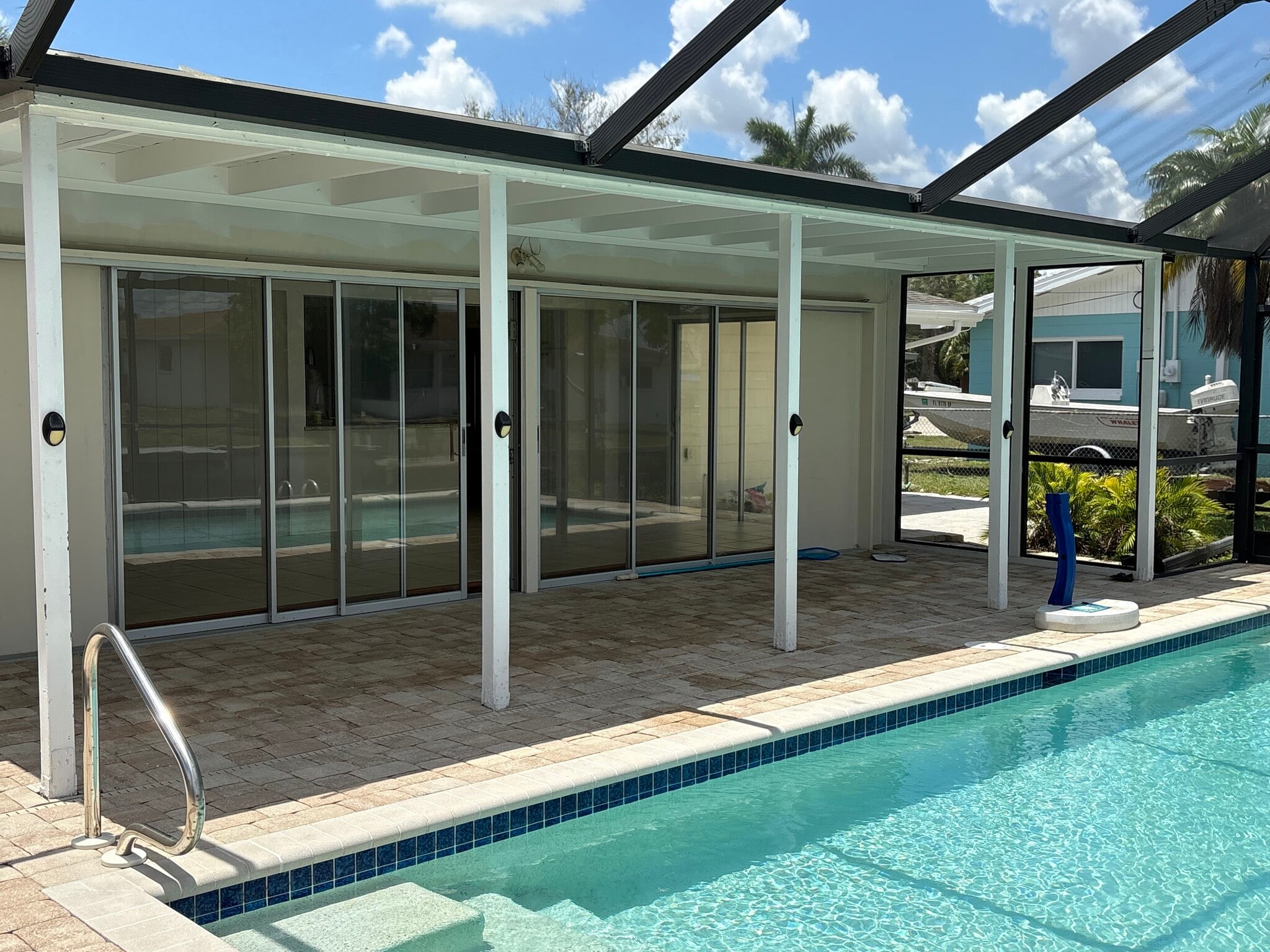 Two triple sliders to open the inside to the outside. No bugs with the screened pool cage. - 4332 S Atlantic Cir