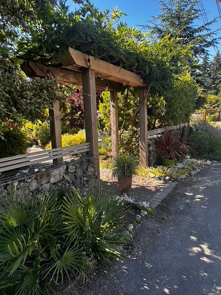 Thoughtful landscaping creates a welcoming first impression. - 11639 1st Ave NW