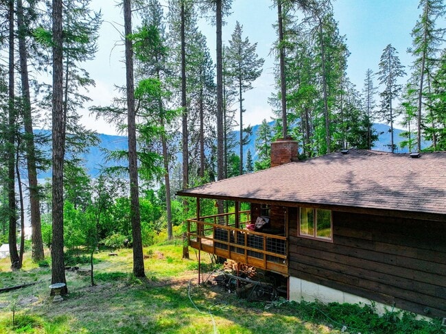 Building Photo - 2700 + sq ft family home has it all! Over 2 acres of land and a stunning view of Lake Pend Oreille