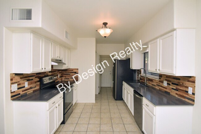 Building Photo - Updated SE Tucson 3BR/2.5BA Gem: Cathedral Ceilings & Private Wash Views