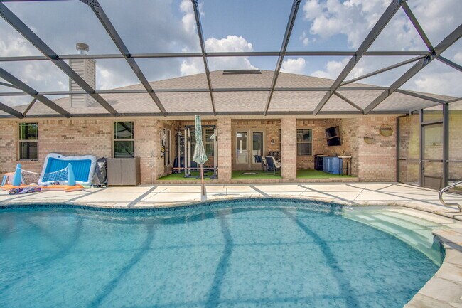 Building Photo - Milton 4BR Pool Home with Office, Vaulted Ceilings, Screened Saltwater Pool & 2-Car Garage