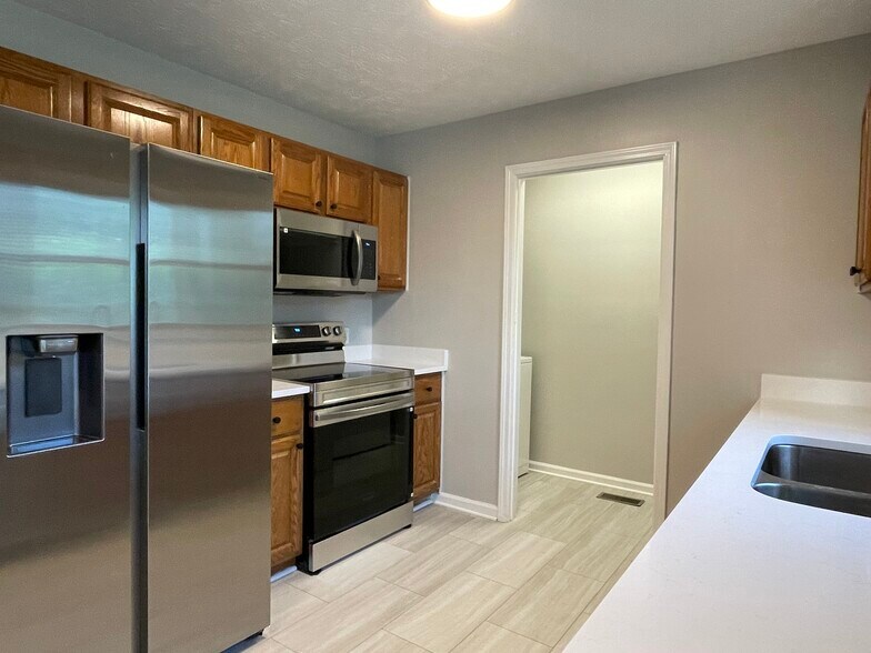 Kitchen w/ brand new appliances - 10521 Cornell Ave
