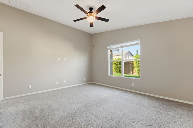 Building Photo - Stunning 4-Bed + Den Eastmark Home with Modern Upgrades Throughout