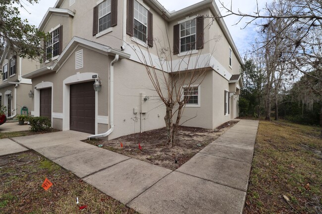 Building Photo - Town home 2 story, 3/2.5/1 backing up to T...