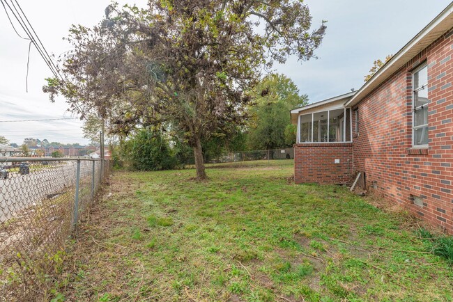 Building Photo - Brick home with a fenced-in yard!