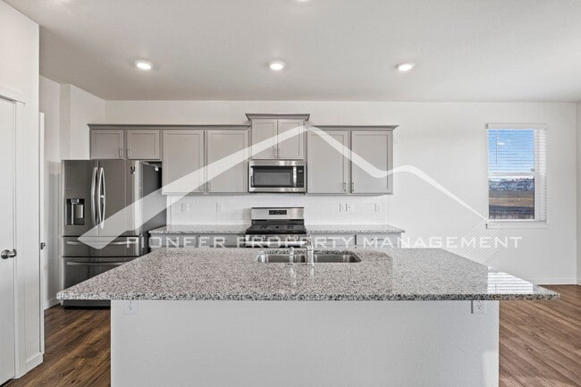 Building Photo - Modern 4-Bed, 2.5-Bath Home with 2 car garage, AC and Private Enclosed Yard