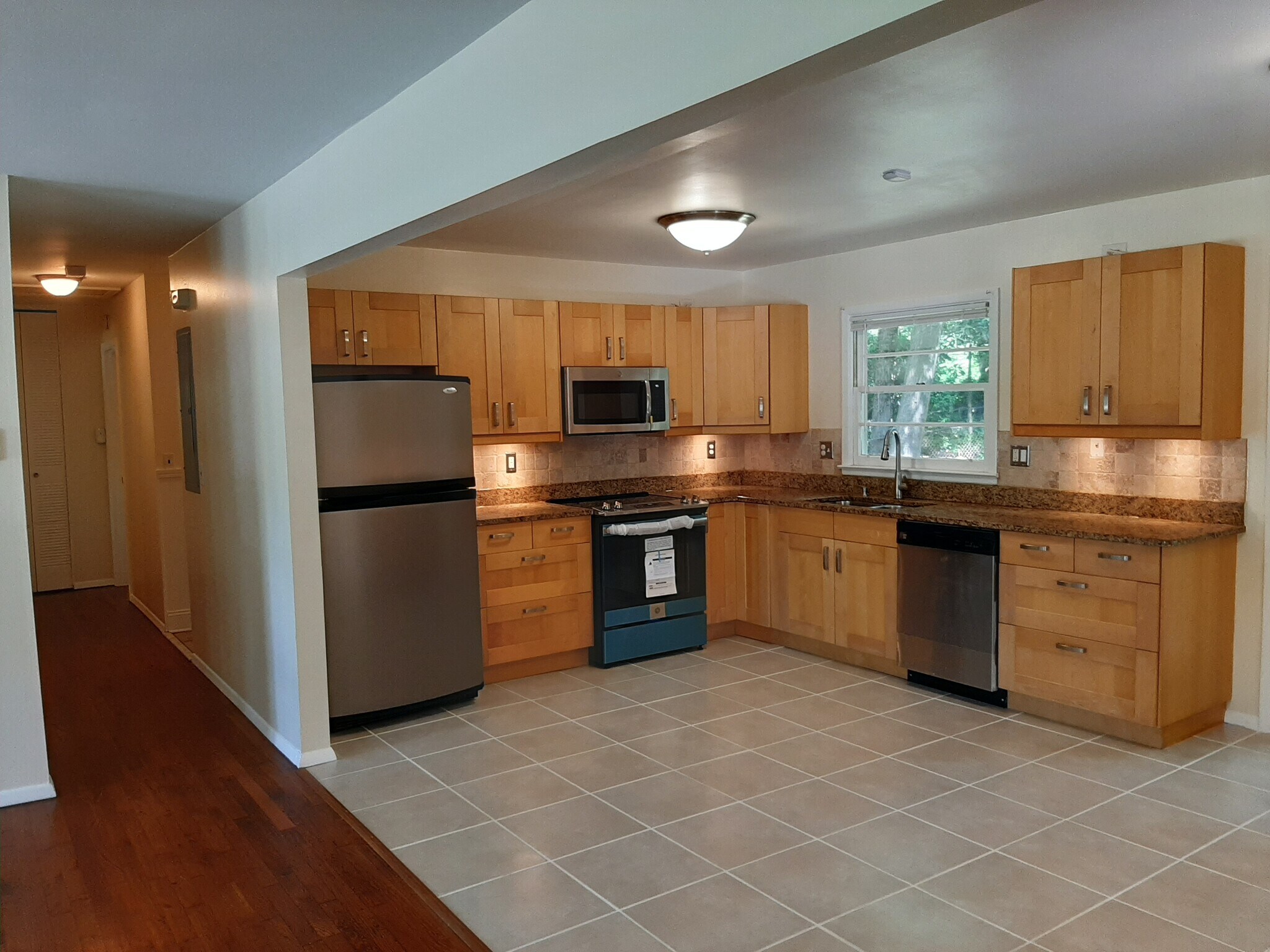 The kitchen has views of the large, private, and green backyard. - 2955 Fantasy Ln