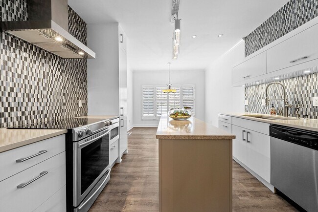 Building Photo - Rare Luxury 3-Story Townhome in Walton School District – Dual Kitchens, Double Decks & More!