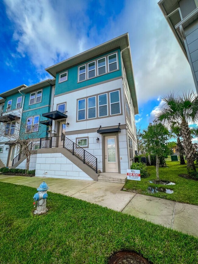 Building Photo - Luxury 4-Bedroom Townhome in Laureate Park – Now Available!