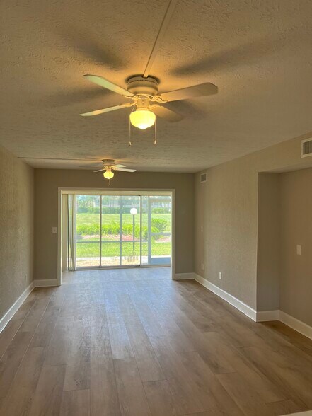Living Room With Glassed In Sunroom - 16251 Dublin Cir