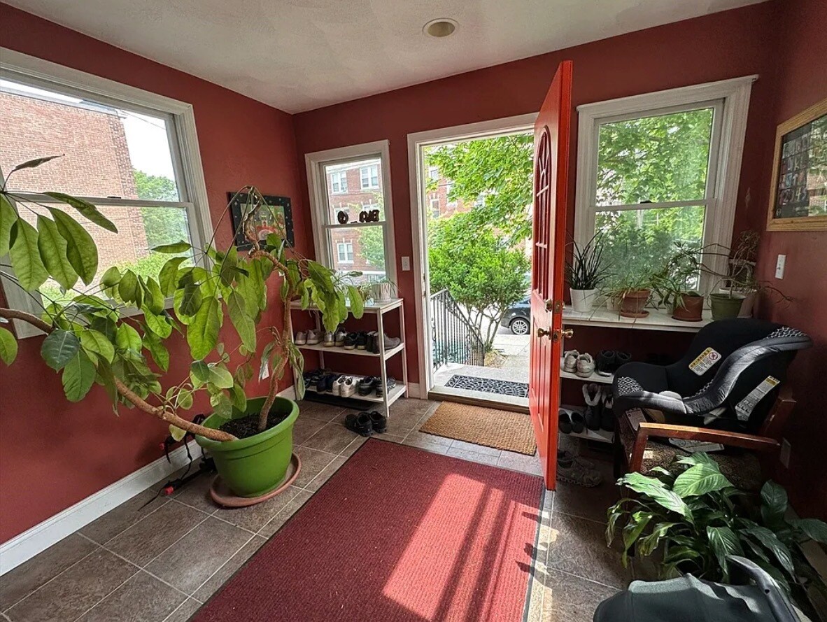 Mudroom with steps down to postbox and street - 124 Bynner St
