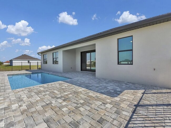 Building Photo - Almost New Construction Waterfront Home in NE Cape Featuring A Pool, Fenced Yard & More! COMING SOON