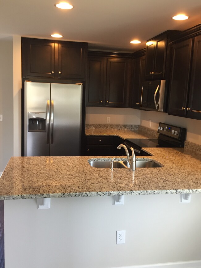 Kitchen has stainless steel appliances - 1816 Riverbirch Lane