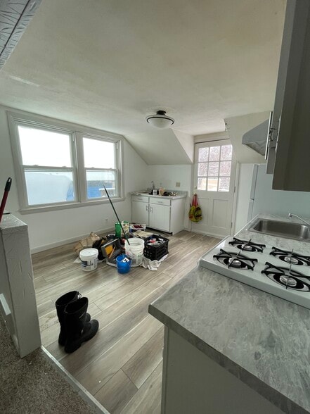 Newly renovated kitchen looking at front door - 29 Center St