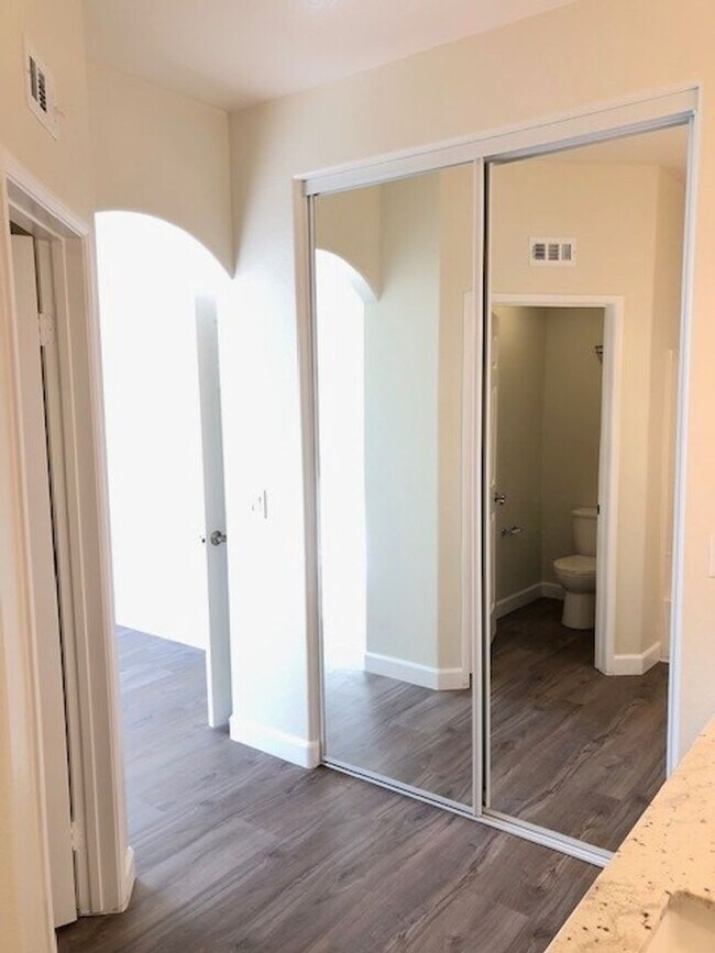 Building Photo - PICTURE PERFECT 2 BR/2 BATH PLUS LOFT END UNIT CONDO WITH DIRECT ACCESS 2 CAR GARAGE