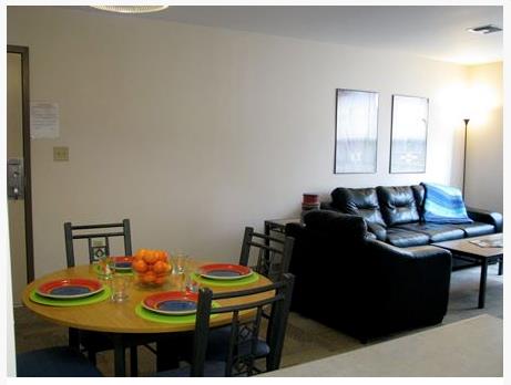 fully furnished dining & living room - Honeysuckle Student Apartments