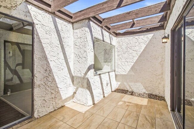 Building Photo - Gated 3-Bedroom Townhome with Fireplace, Patio & 2-Car Garage