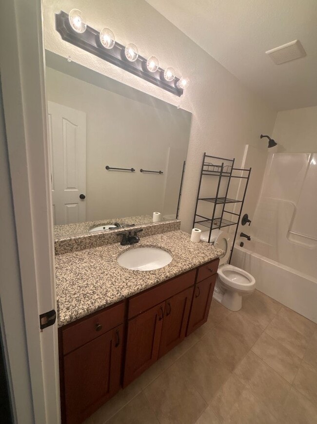 Building Photo - Spacious 4-Bedroom Home Near Base – No Tun...
