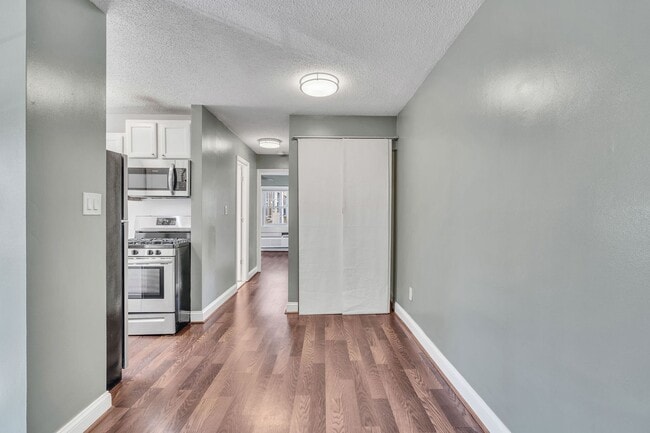 Building Photo - Utilities Included! Updated 2-Bedroom Condo Just Steps from Huntington Metro
