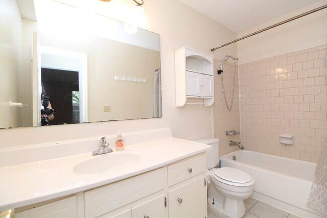 Building Photo - 2BR Home with Wood-Look Flooring, Fenced Backyard & Private Patio