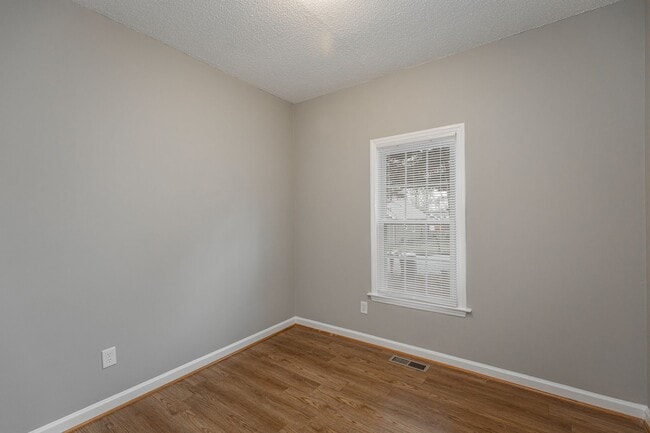 Building Photo - Like New Home off Freeman Mill.  Just Painted, New Wood/Vinyl Flooring, Vaulted Ceilings, Front P...