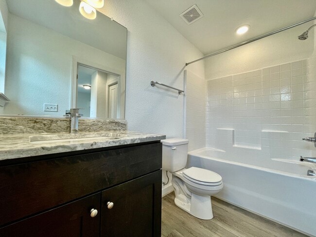 Building Photo - Practically New & Available NOW! Americana Luxury Townhomes! Pet Friendly! Attached Garage! All A...