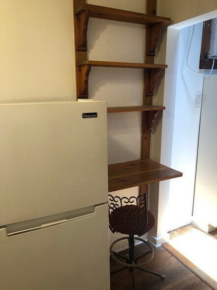 Collapsible kitchen workspace with storage shelves - 508 Bellevue Pl